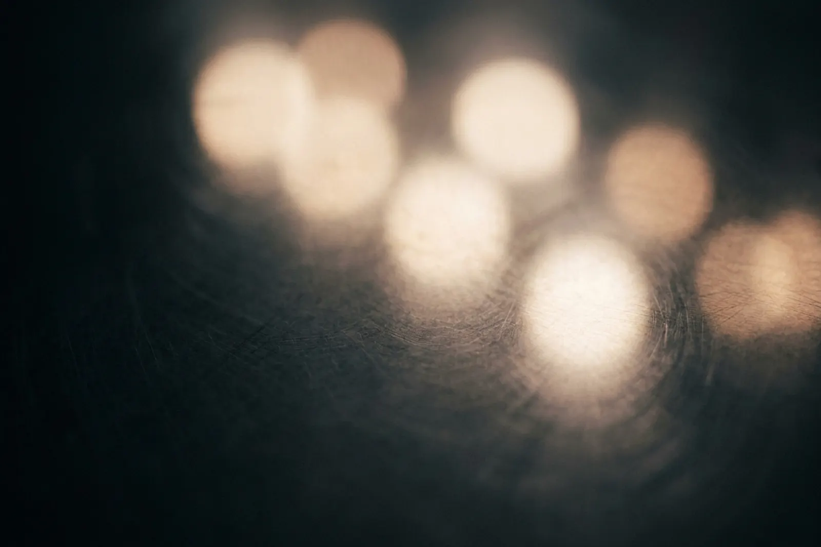 Soft gleam of a surgical light against a darkened room